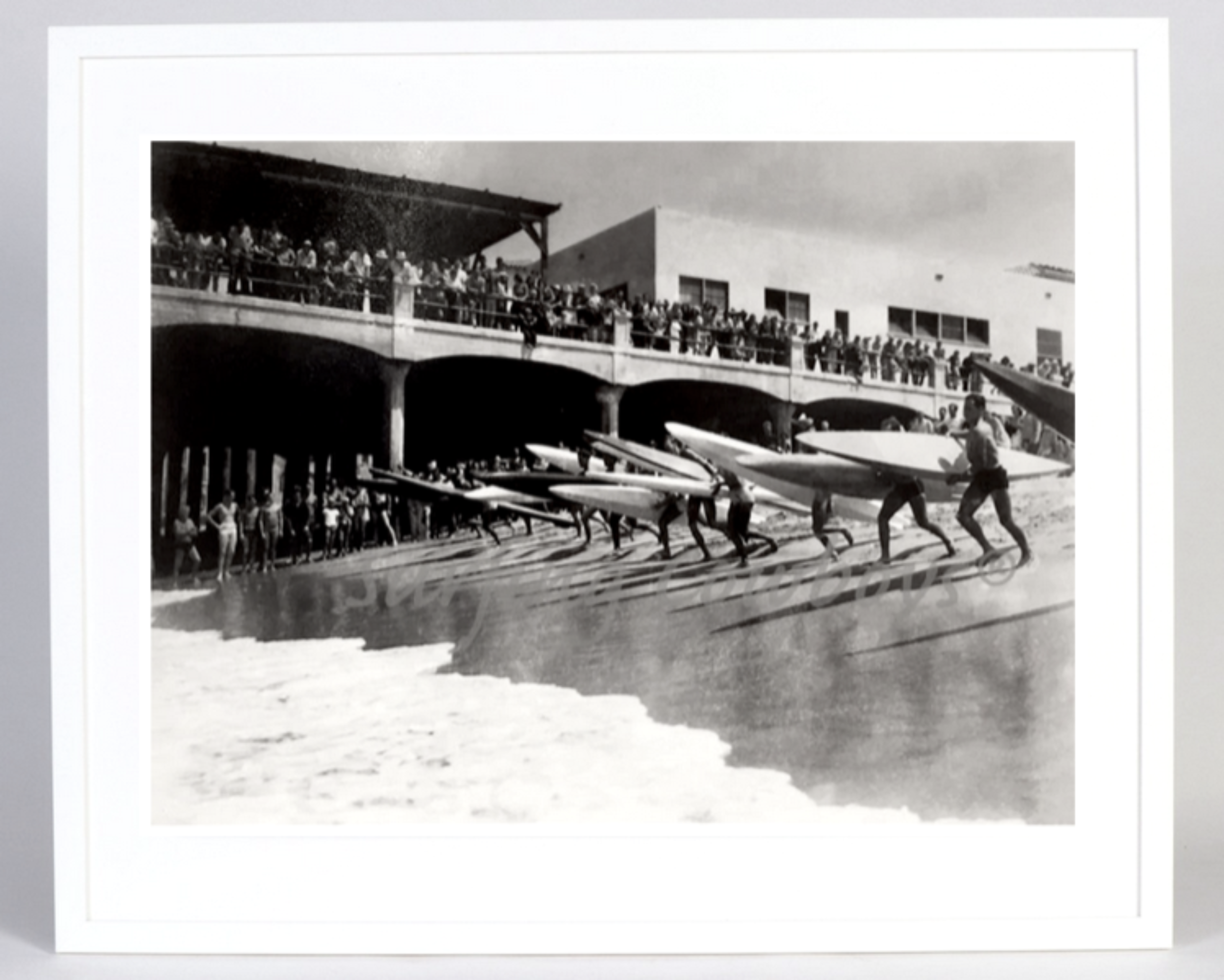 The full view of the Archival Surf Photo Hermosa Beach Pier Paddleboard Surf Race in the White Wood Frame.