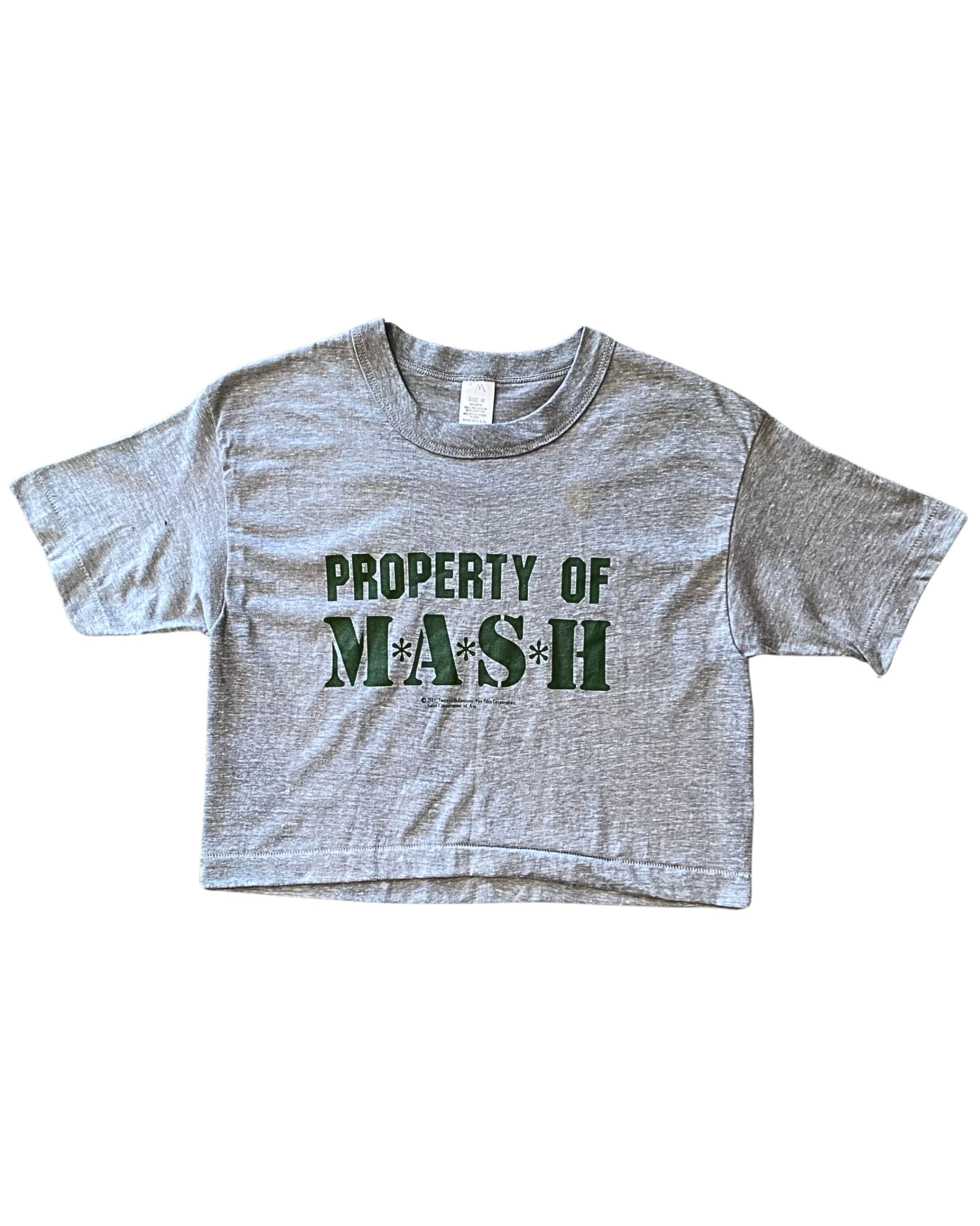Front of vintage 1981 MAS*H cropped T-shirt with green logo.