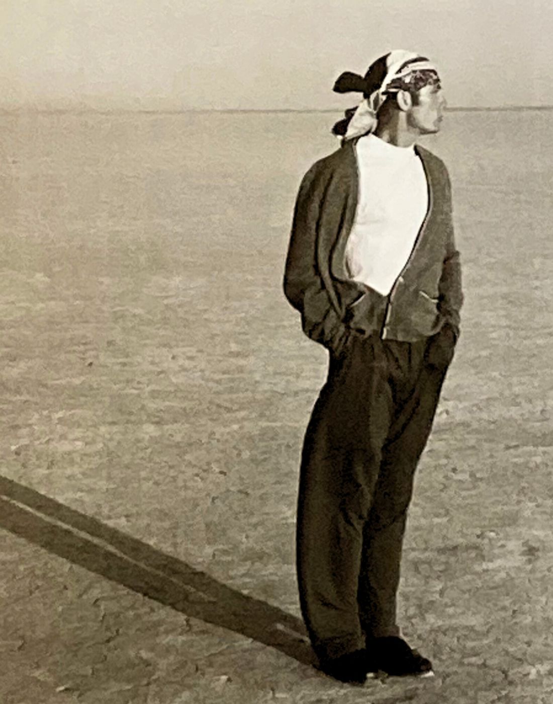 Man Standing In Desert With Hands In Pockets