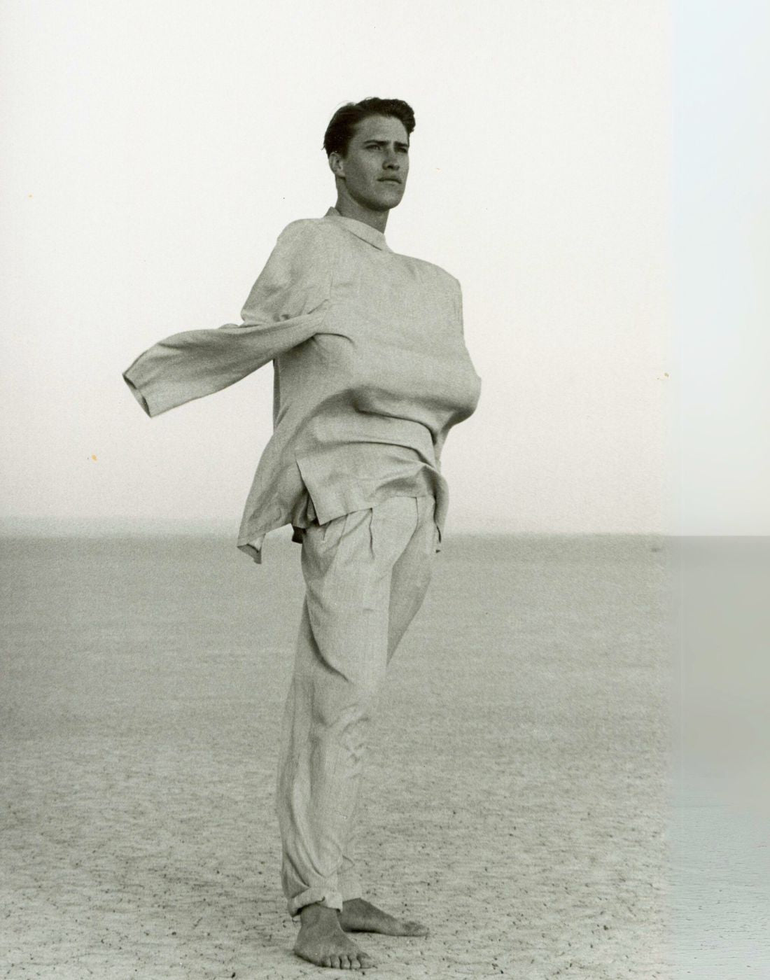 Man Posed With Blowing Jacket With Arms Tucked In