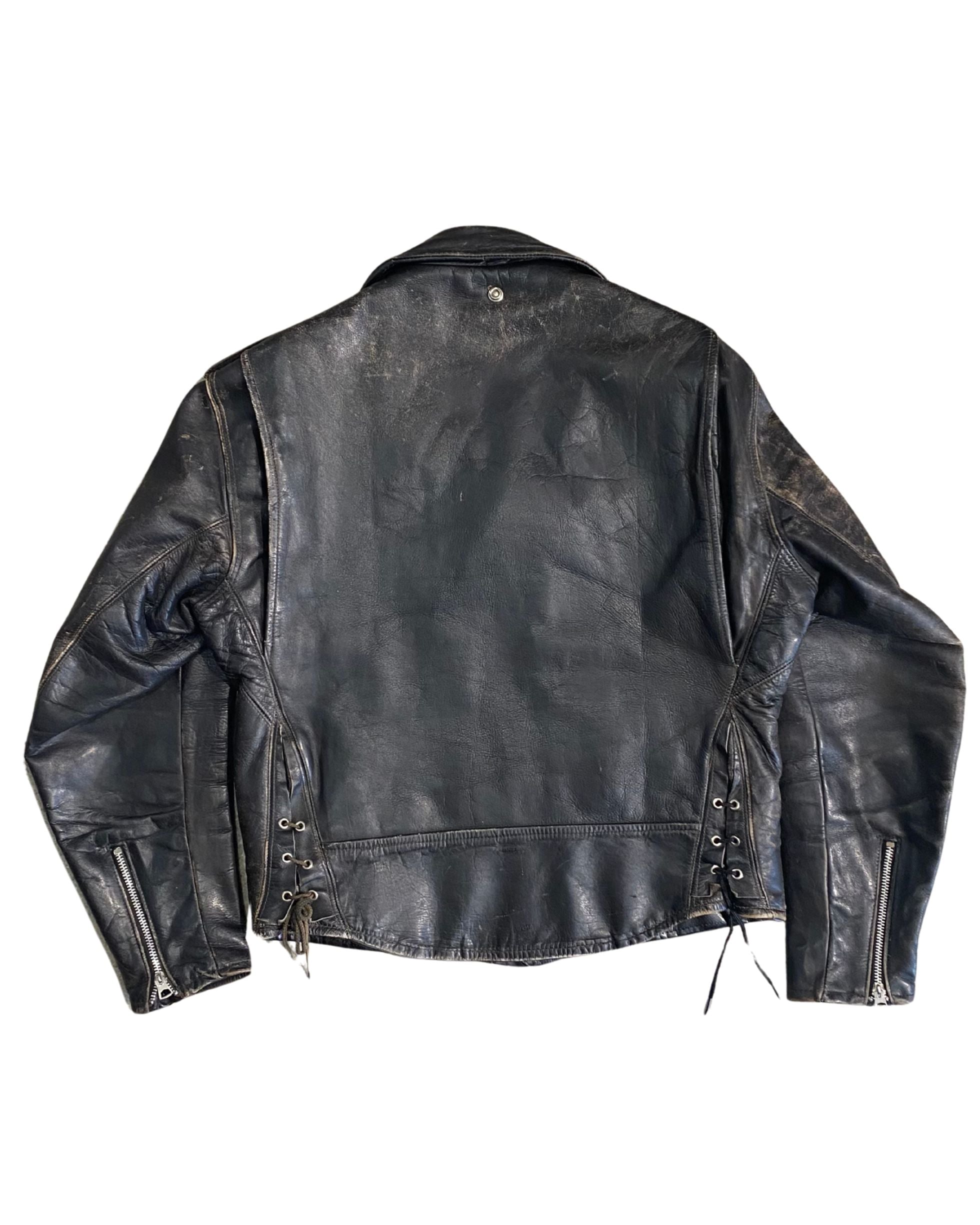 Back view of 1960s vintage biker jacket with lace-up sides and worn leather finish.