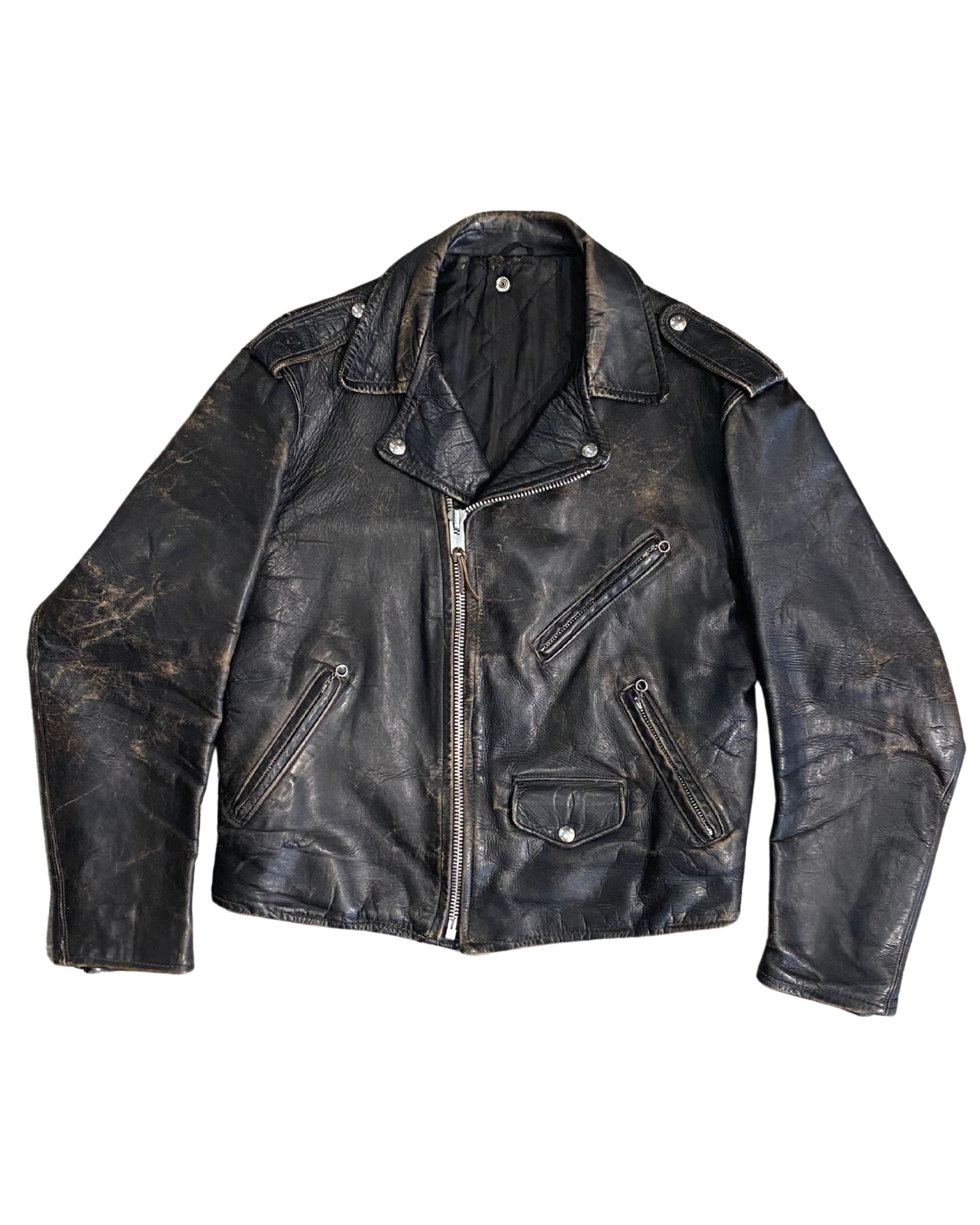Front view of 1960s black leather motorcycle jacket with asymmetrical zip and pocket details.
