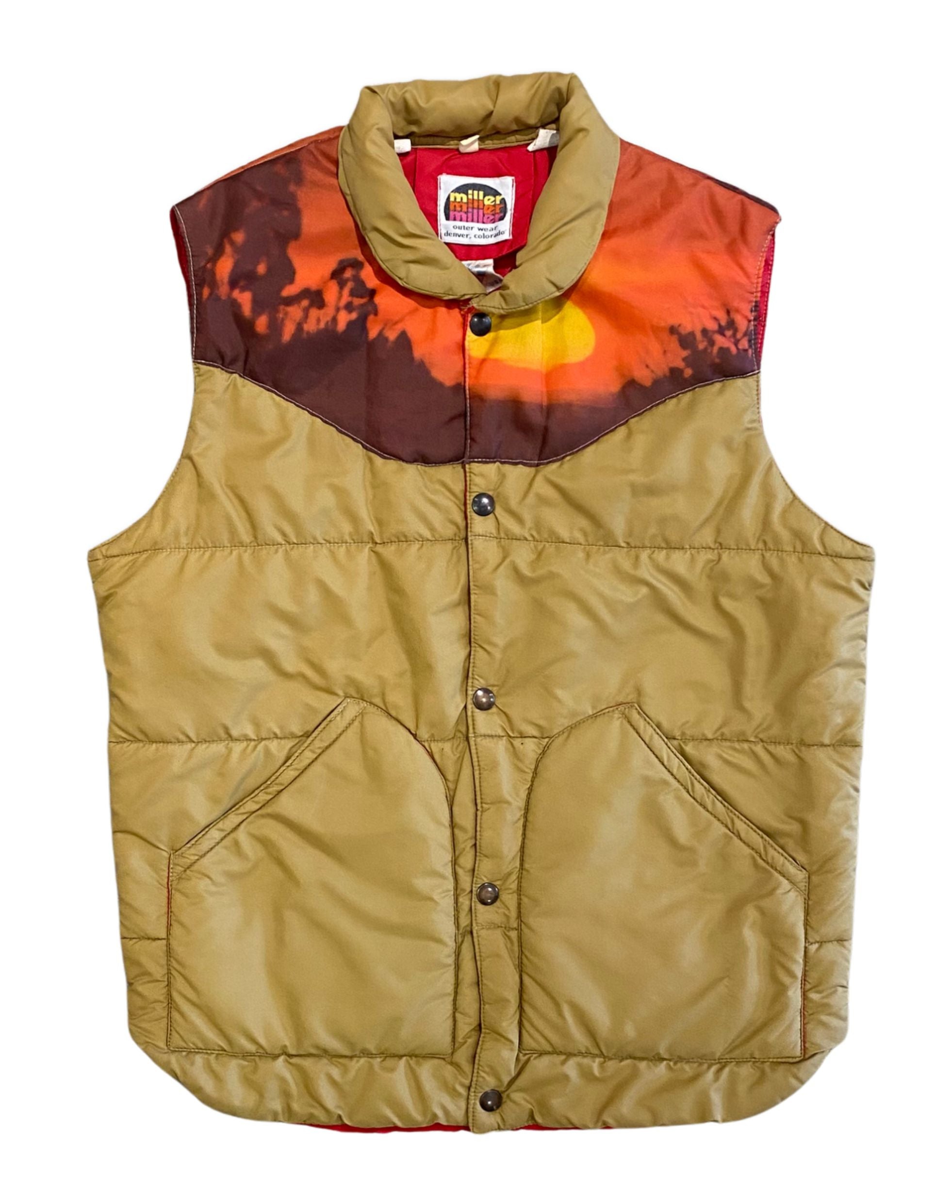 Front view of a tan 1970s Miller Outer Wear nylon puffer vest with an orange sunrise landscape yoke, snap closure, and patch pockets.