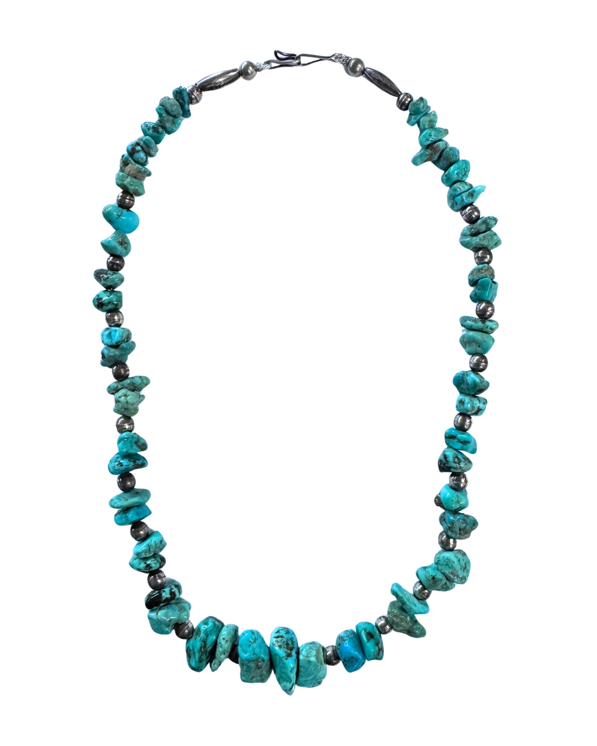 Full view of a 20-inch necklace with graduated irregular turquoise nuggets, darkened round and elongated silver beads, and a hook closure.
