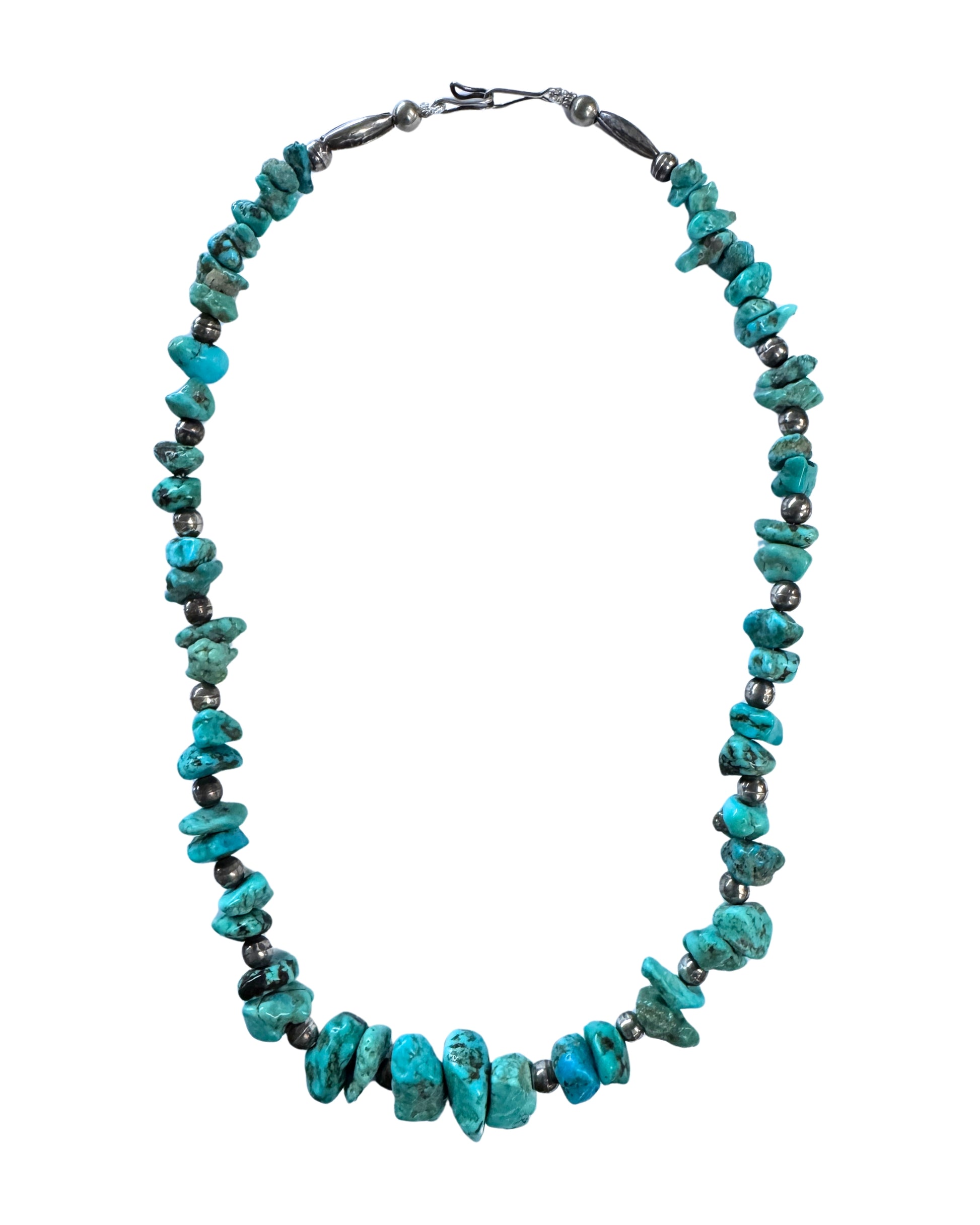 Full view of a 20-inch necklace with graduated irregular turquoise nuggets, darkened round and elongated silver beads, and a hook closure.
