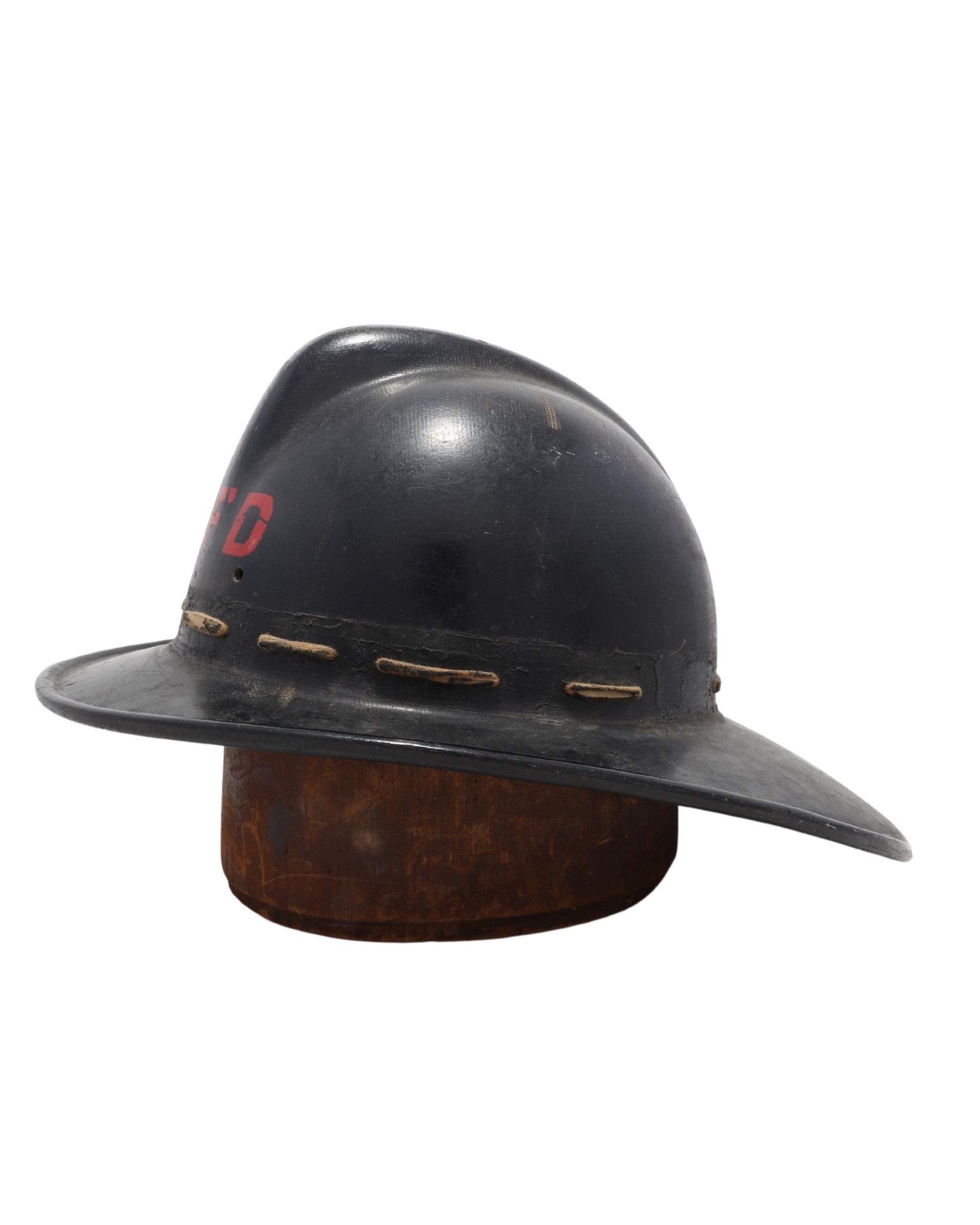 Opposite side view of high-comb fireman’s helmet.