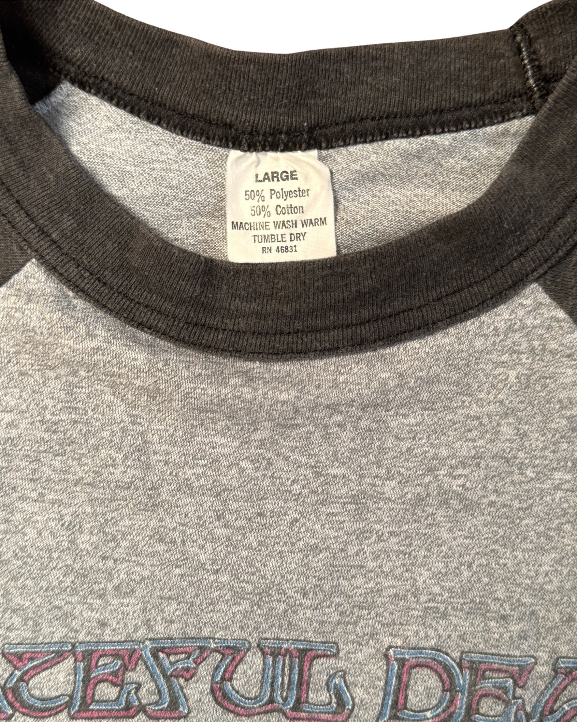 Grateful Dead 1982 shirt label showing size and material.