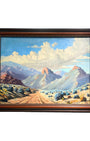 Framed painting of a mountain landscape with a dirt road and blue sky.