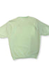 Back view of vintage mint green knit shirt with solid back and short sleeves.
