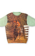 Front view of circa 1970s mint green knit shirt with full-front cowboy rodeo photo print.