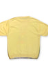 Back view of vintage yellow knit shirt with solid yellow back.