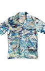 Vintage 1970s all-over surfer print shirt in blue and white with short sleeves and button-up front. Front view.