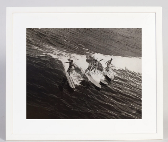 The full view of the Archival Surf Photo Four Wave Riders on Wood Boards Manhattan Beach c. 1930s in the White Wood Frame.