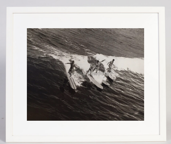 The full view of the Archival Surf Photo Four Wave Riders on Wood Boards Manhattan Beach c. 1930s in the White Wood Frame.