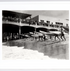 The full view of the Archival Surf Photo Hermosa Beach Pier Paddleboard Surf Race in the White Wood Frame. 