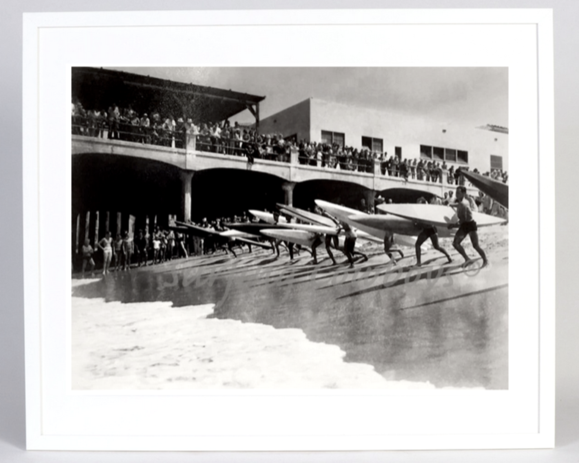 The full view of the Archival Surf Photo Hermosa Beach Pier Paddleboard Surf Race in the White Wood Frame. 