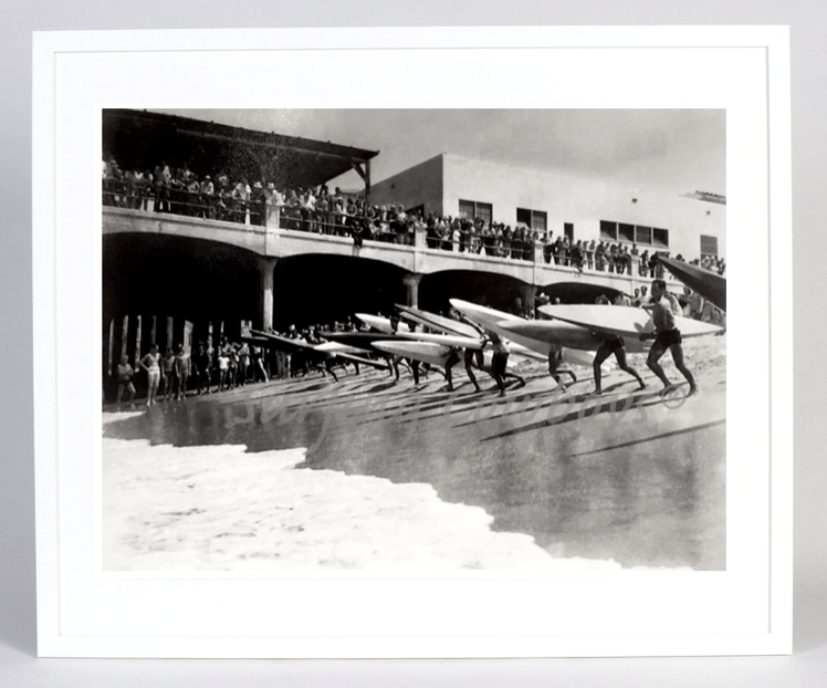 The full view of the Archival Surf Photo Hermosa Beach Pier Paddleboard Surf Race in the White Wood Frame. 