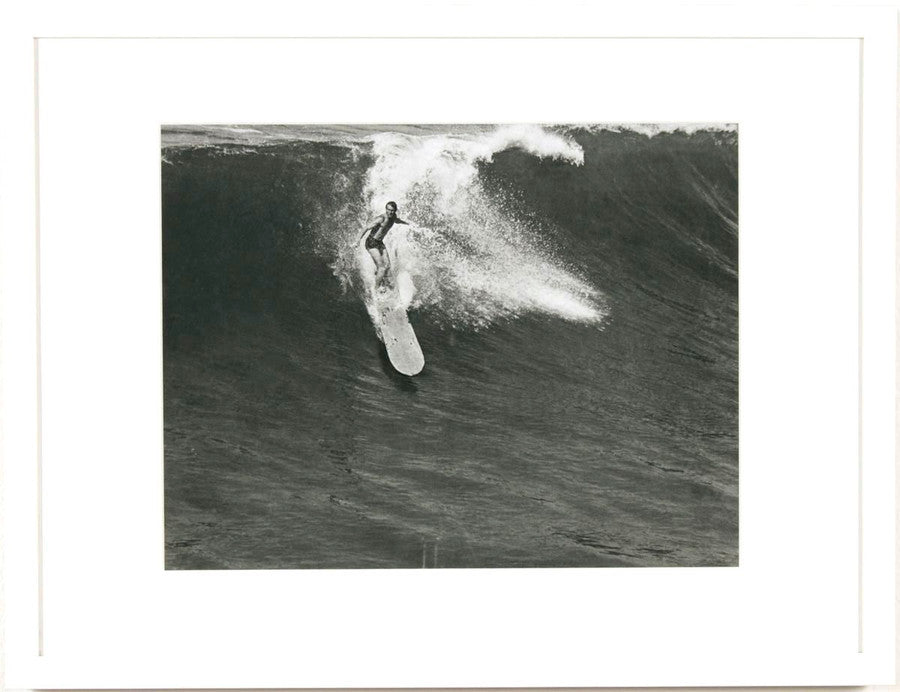 The full view of the Archival Wood Surfboard Down Wave Photo in Manhattan Beach, c. 1930s in White Wood Frame.