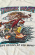 Close-up of the colorful “Think Fast!” graphic showing a wild-eyed monster driving a smoking dragster above the words “Life Begins at 200 MPH!”
