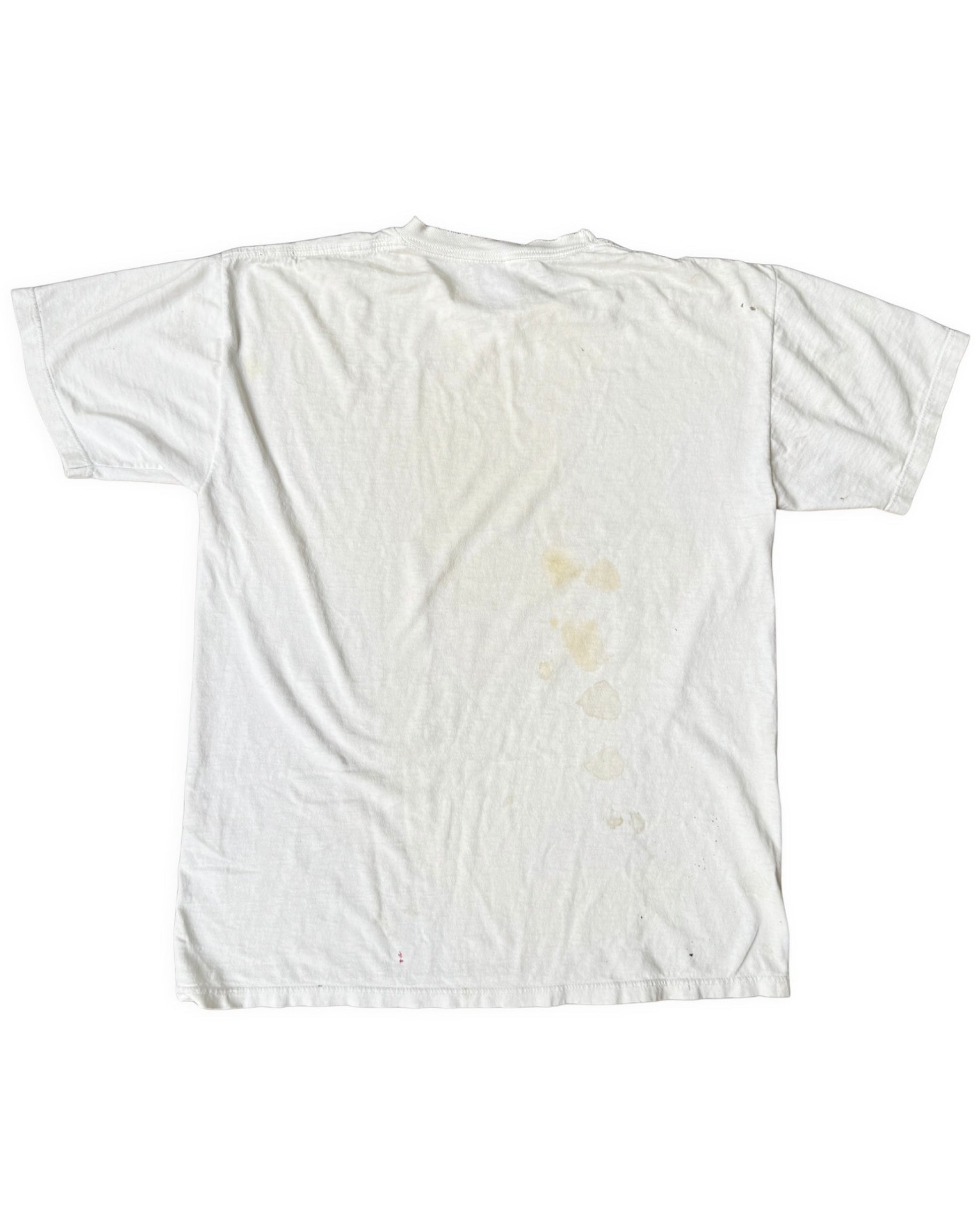 Back view of an aged white short-sleeve T-shirt with yellowish stains down the center and scattered small marks.