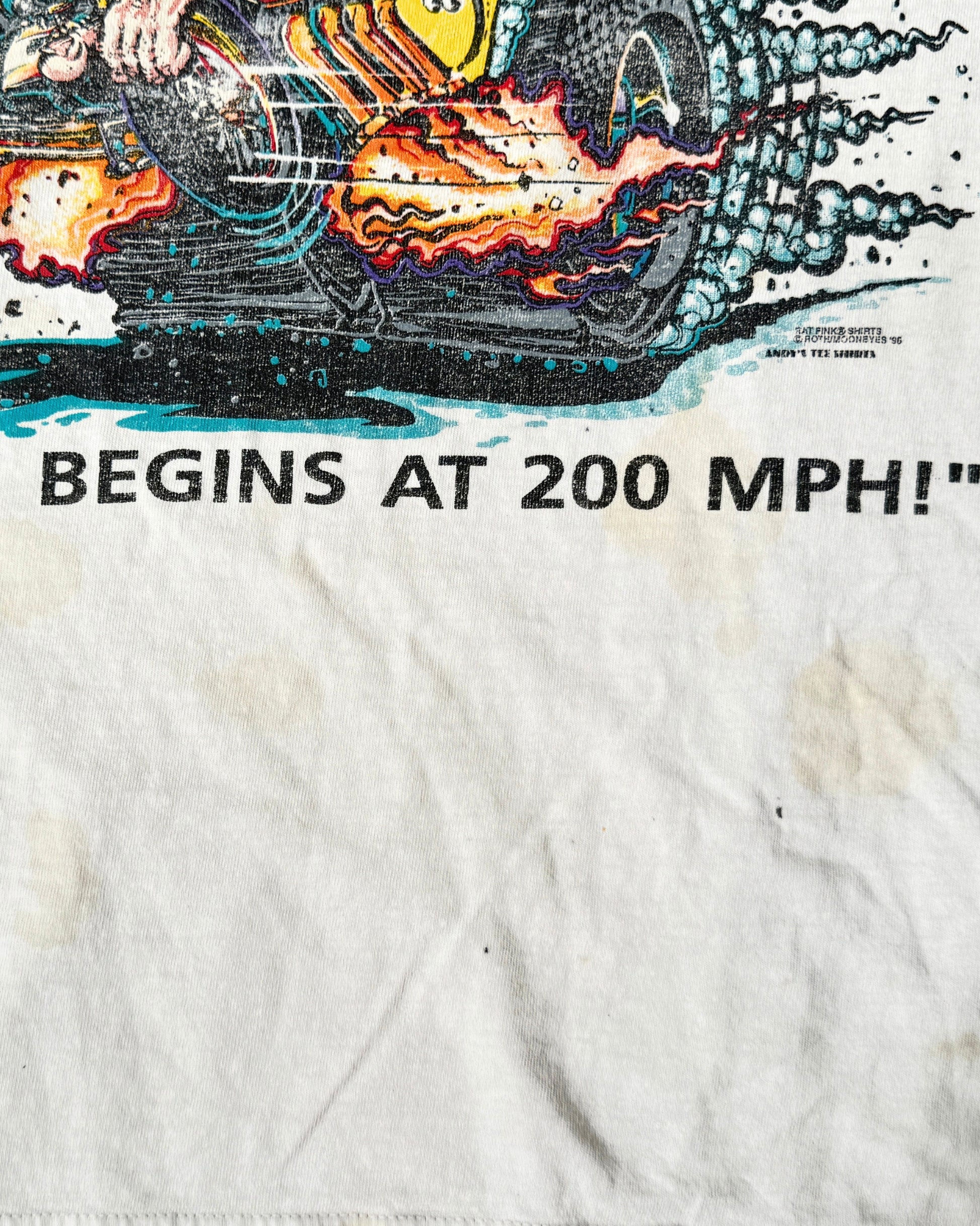Close-up of the lower front showing the bottom of the printed graphic, Roth/MOONEYES credit, yellowish stains, dark marks, and worn white cotton fabric.