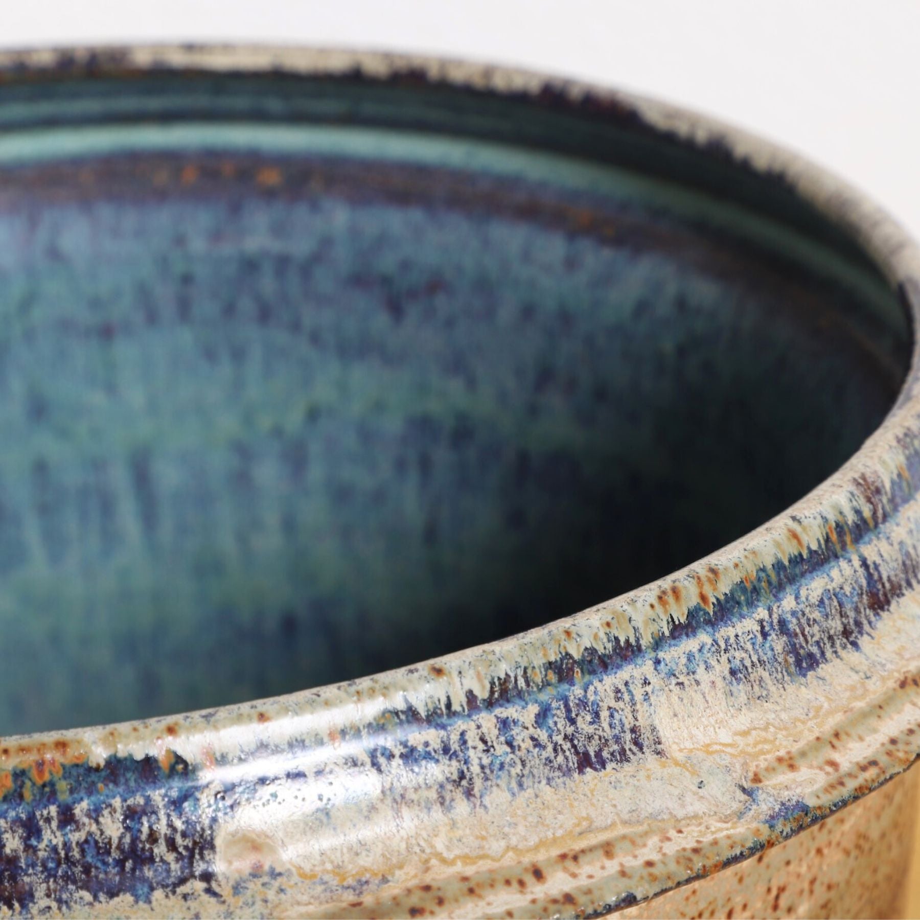 The upclose view of the rim and inside of the Ceramic Pot with Blue Interior, 1970s.