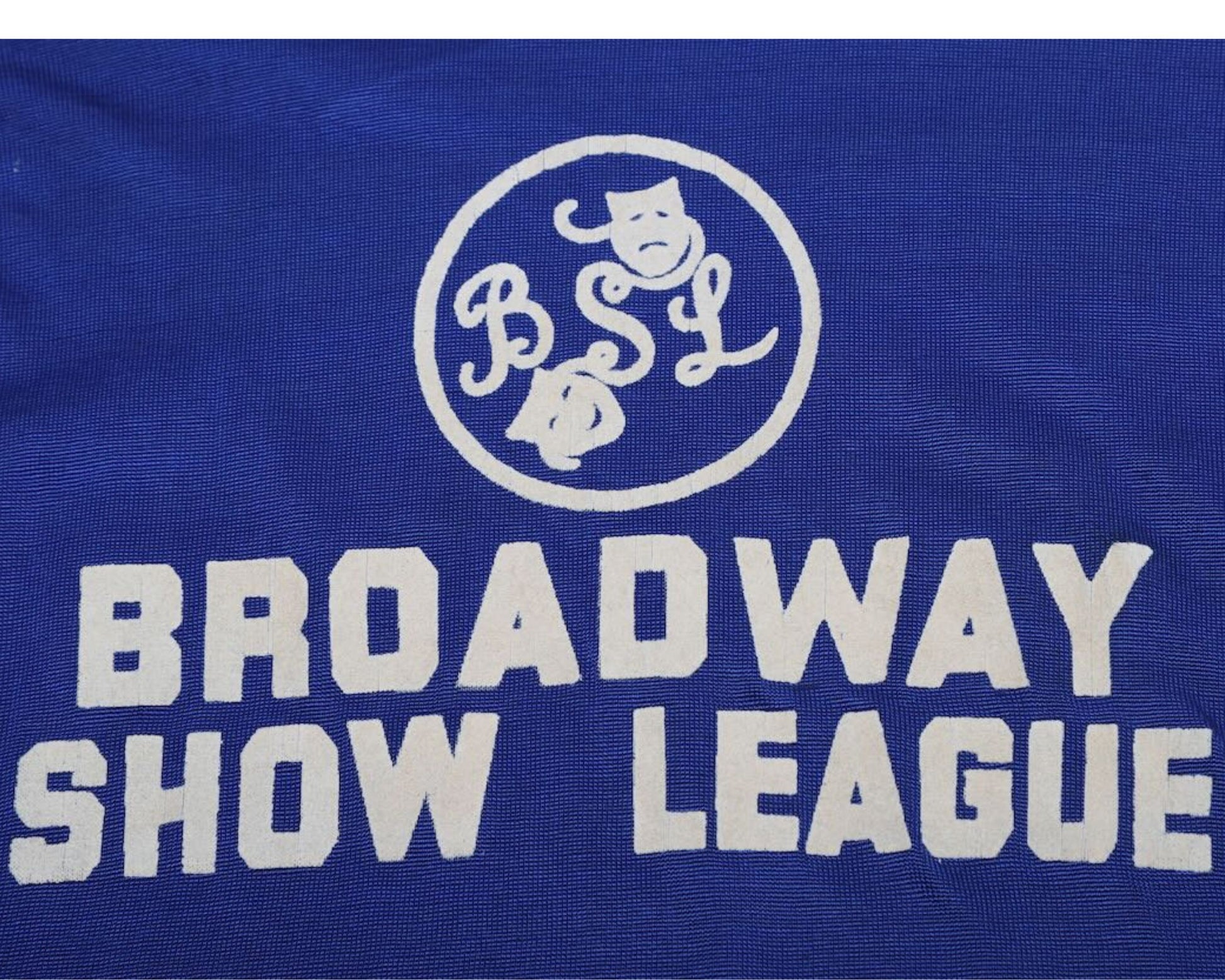 Detail  view of logo on vintage Budd Friedman’s Improvisation Broadway Show League jersey.