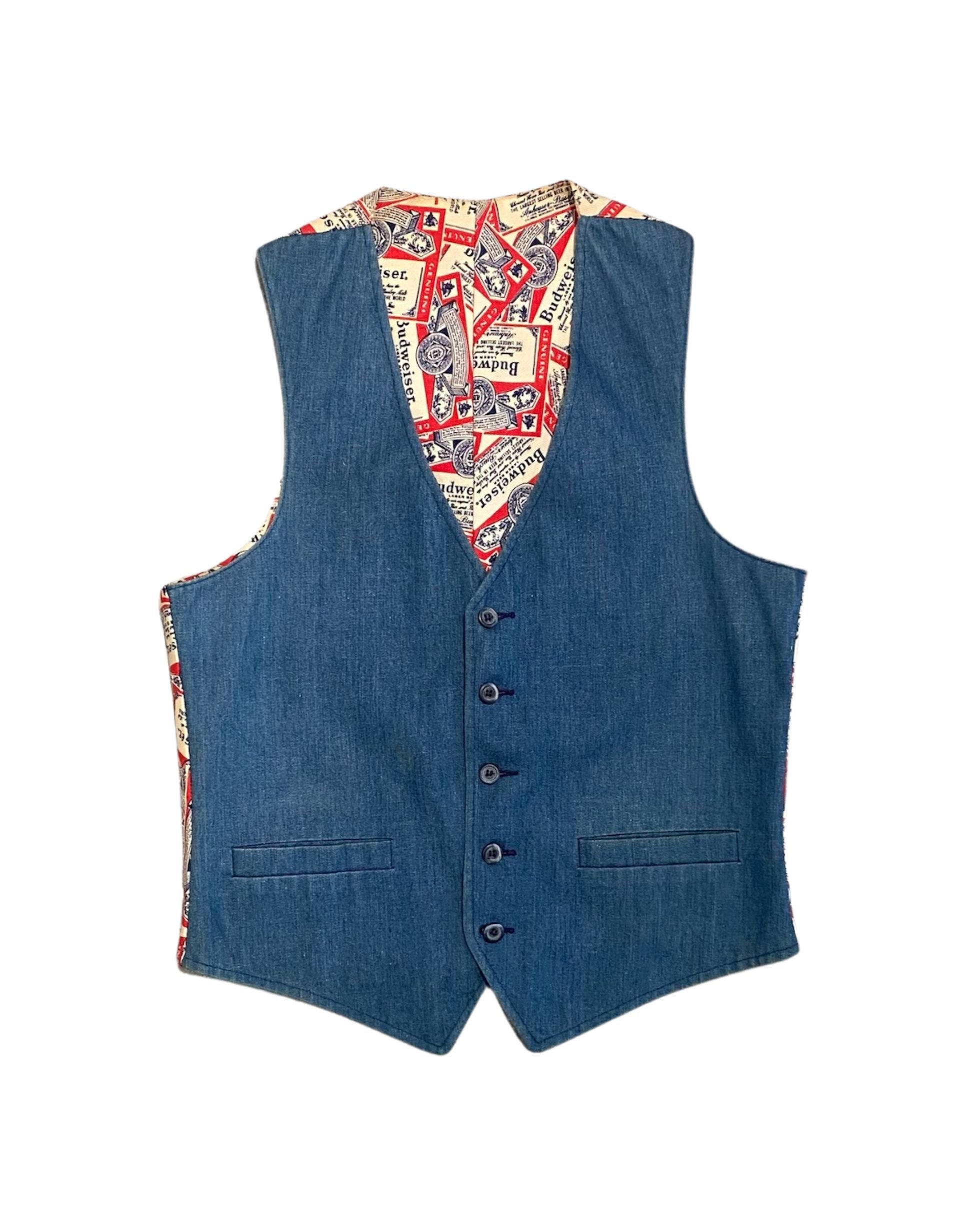Front view of vintage 1970s Budweiser denim vest with blue denim front and button closure.