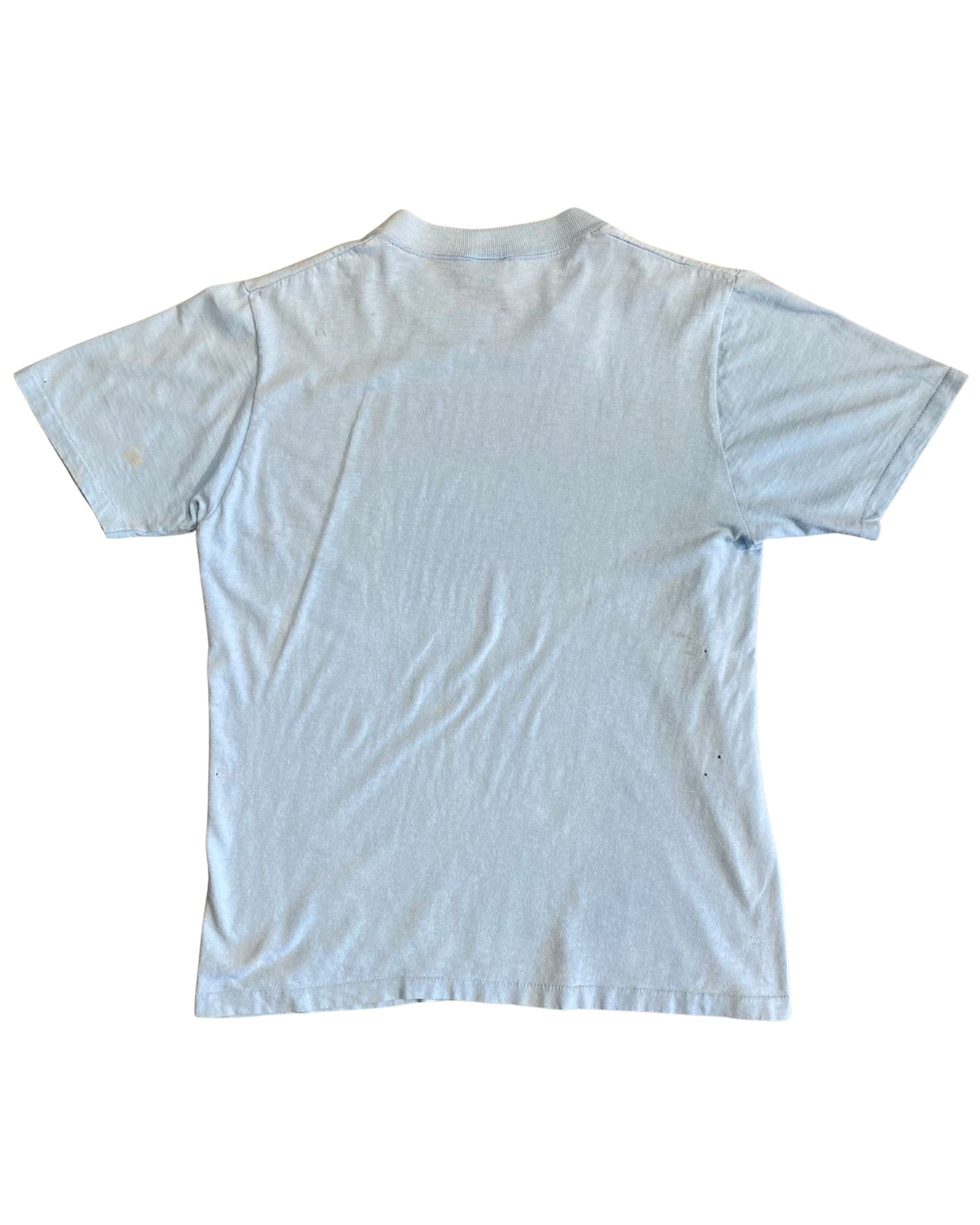 Back of vintage light blue Camaro T-shirt showing worn fabric and age patina.