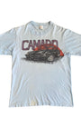 Front of light blue 1970s Camaro airbrush-style T-shirt with red sun and muscle car graphic.