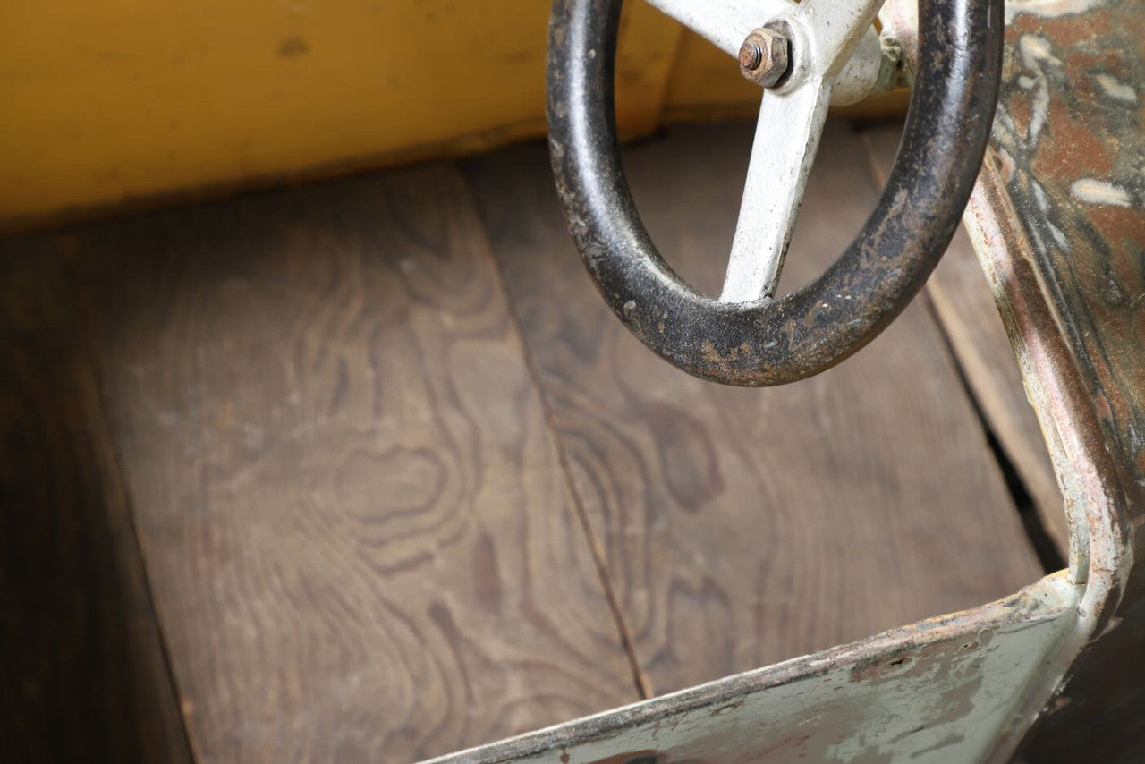 The upclose view of the bottom of the Carnival Car Ride piece, circa 1930s.