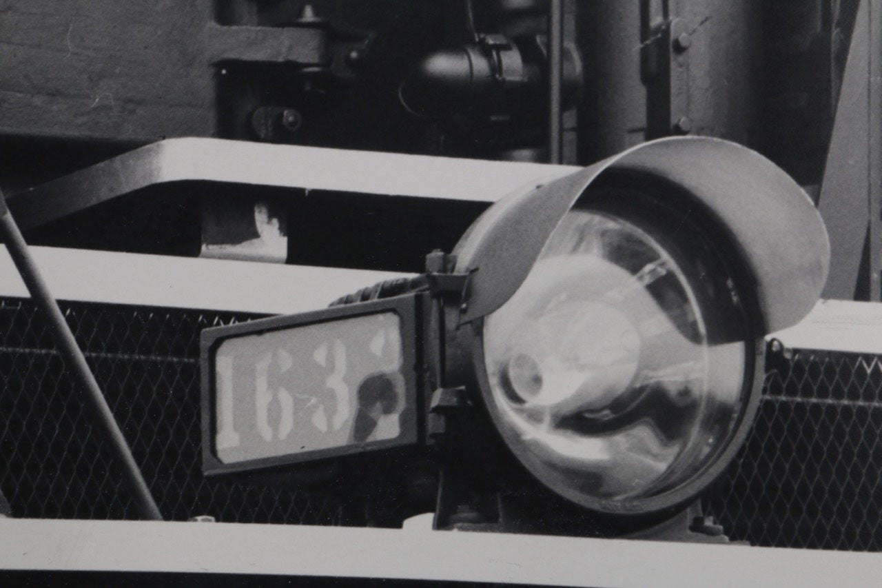 The upclose view of the headlight of the 1940s Chesapeake & Ohio Locomotive Train #1633 Black and White Photograph.