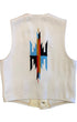 Back of a 1970s Americraft waistcoat showing a large red, blue, black, and ochre geometric motif on an off-white woven body.
