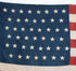 The left upclose view of the blue with stars on the 45 Star American Flag from the Spanish American War, Era 1896-1906.