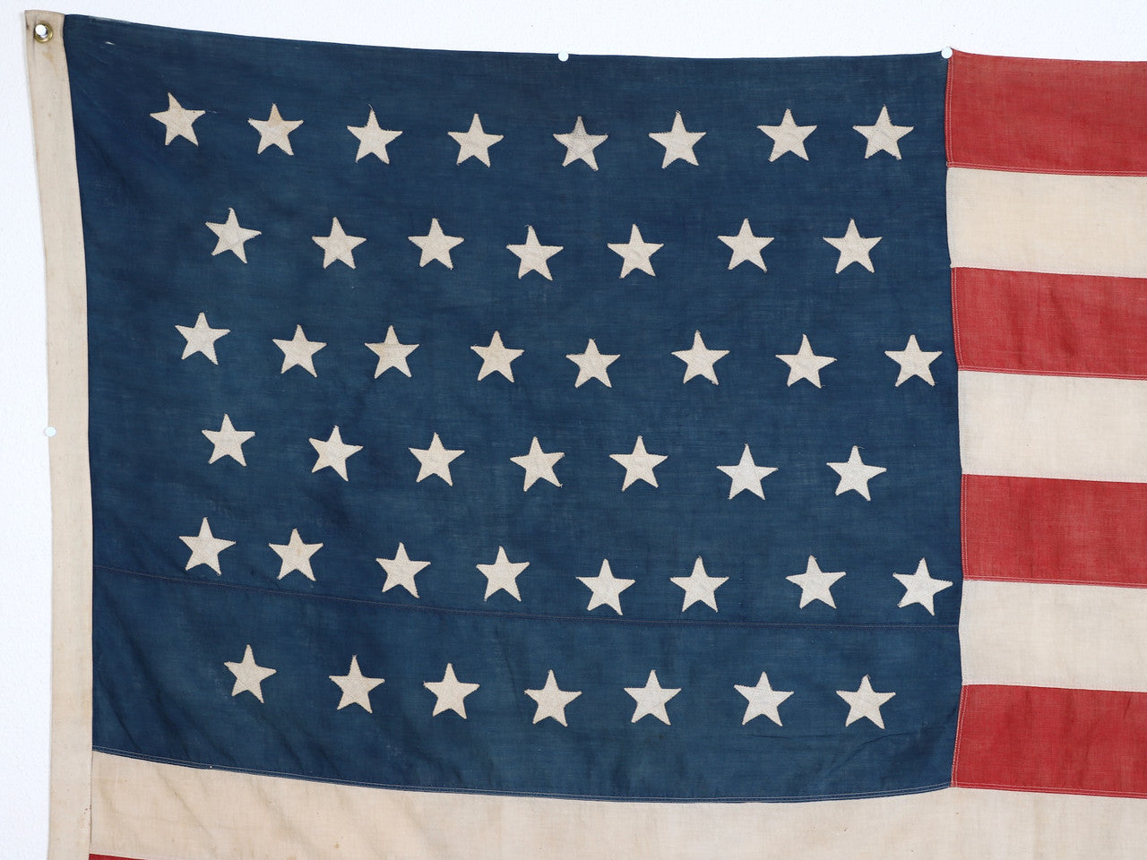 The left upclose view of the blue with stars on the 45 Star American Flag from the Spanish American War, Era 1896-1906.