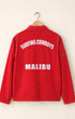Red jacket with 'Surfing Cowboys Malibu' text on a beige background