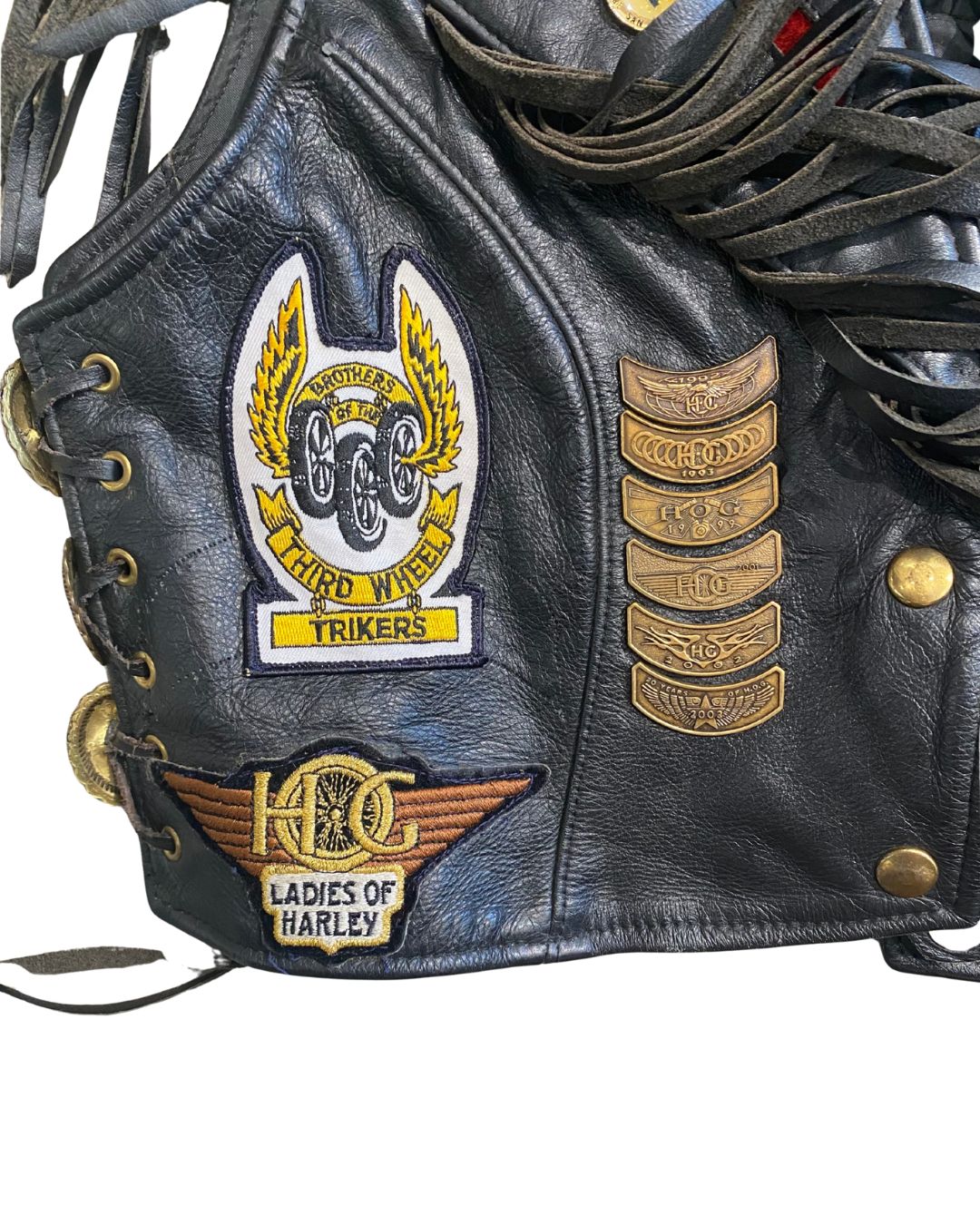 Close-up of Ladies of Harley patch and vintage Harley pins.