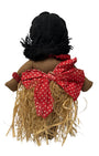 Back of Vintage 1940s cloth Hula doll with showing yarn hair red polka dot bow and raffia grass skirt. 