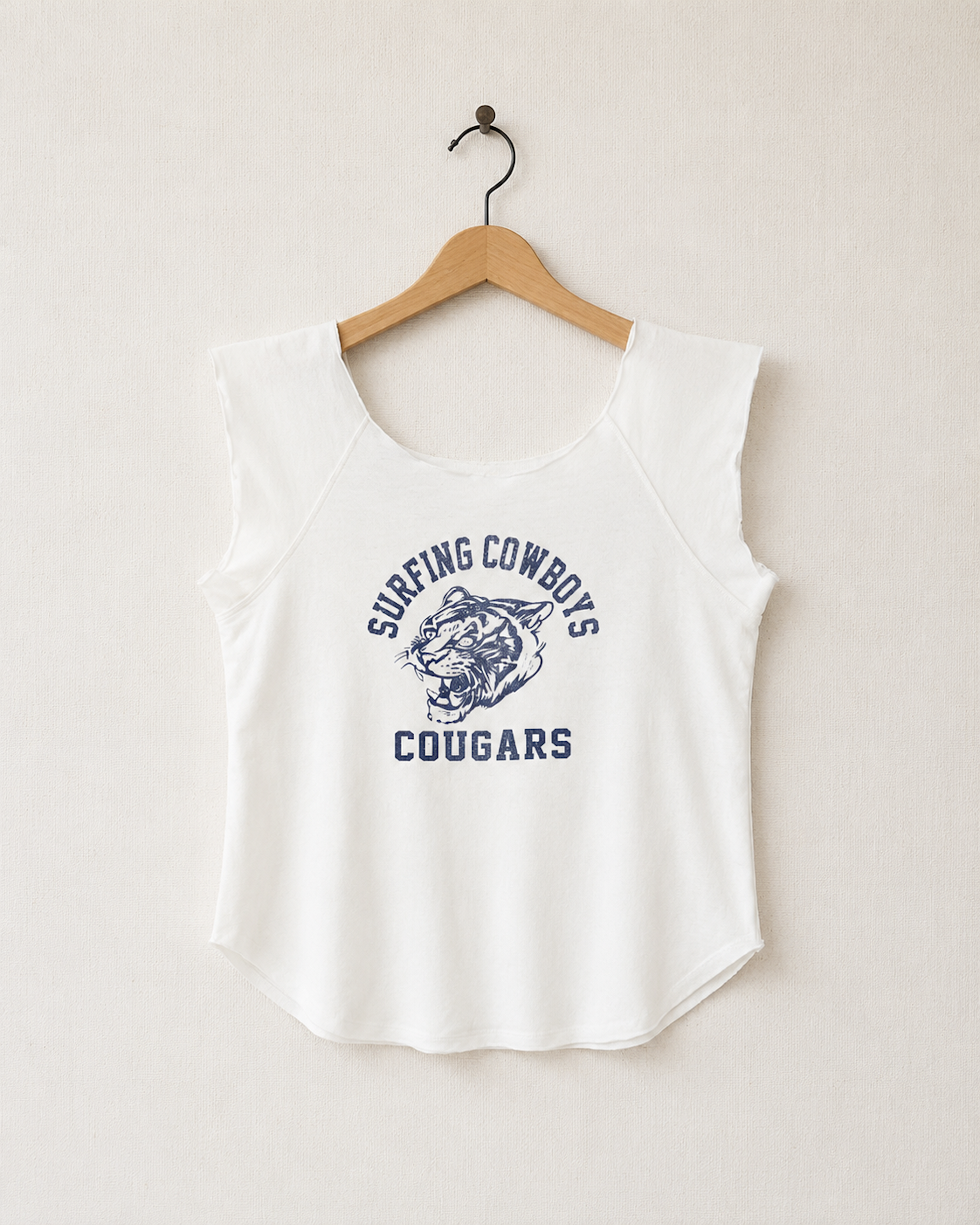 Front View of Vintage White Surfing Cowboys Cougars raw-scoop raglan top with collegiate-style cougar front graphic. 