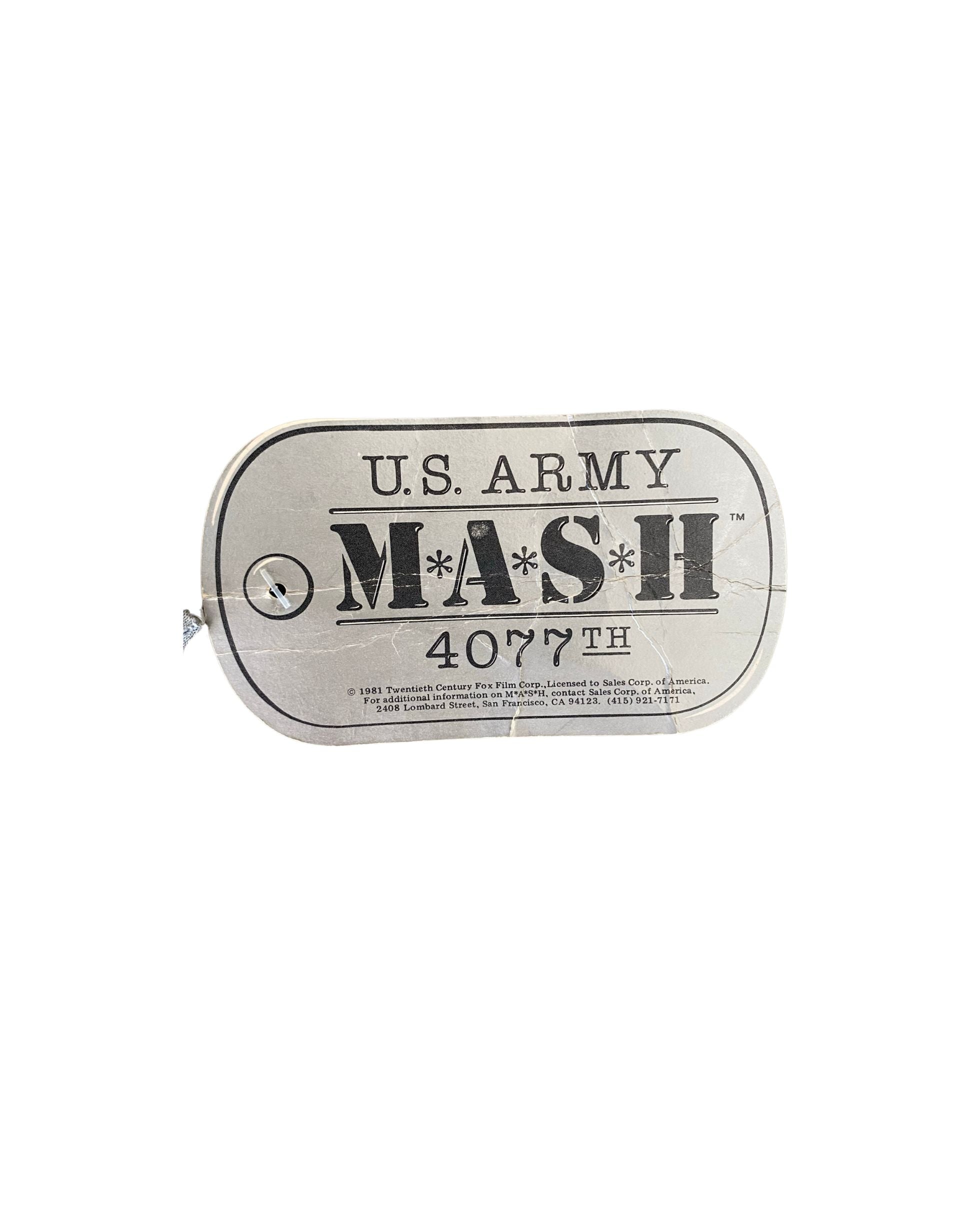 Close-up of original MAS*H 4077th licensed hang tag from 1981.