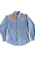 Front view of 1970s snap button denim shirt with vibrant floral embroidery.
