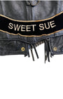 Detailed view of Sweet Sue name patch and Harley Honey embroidery.