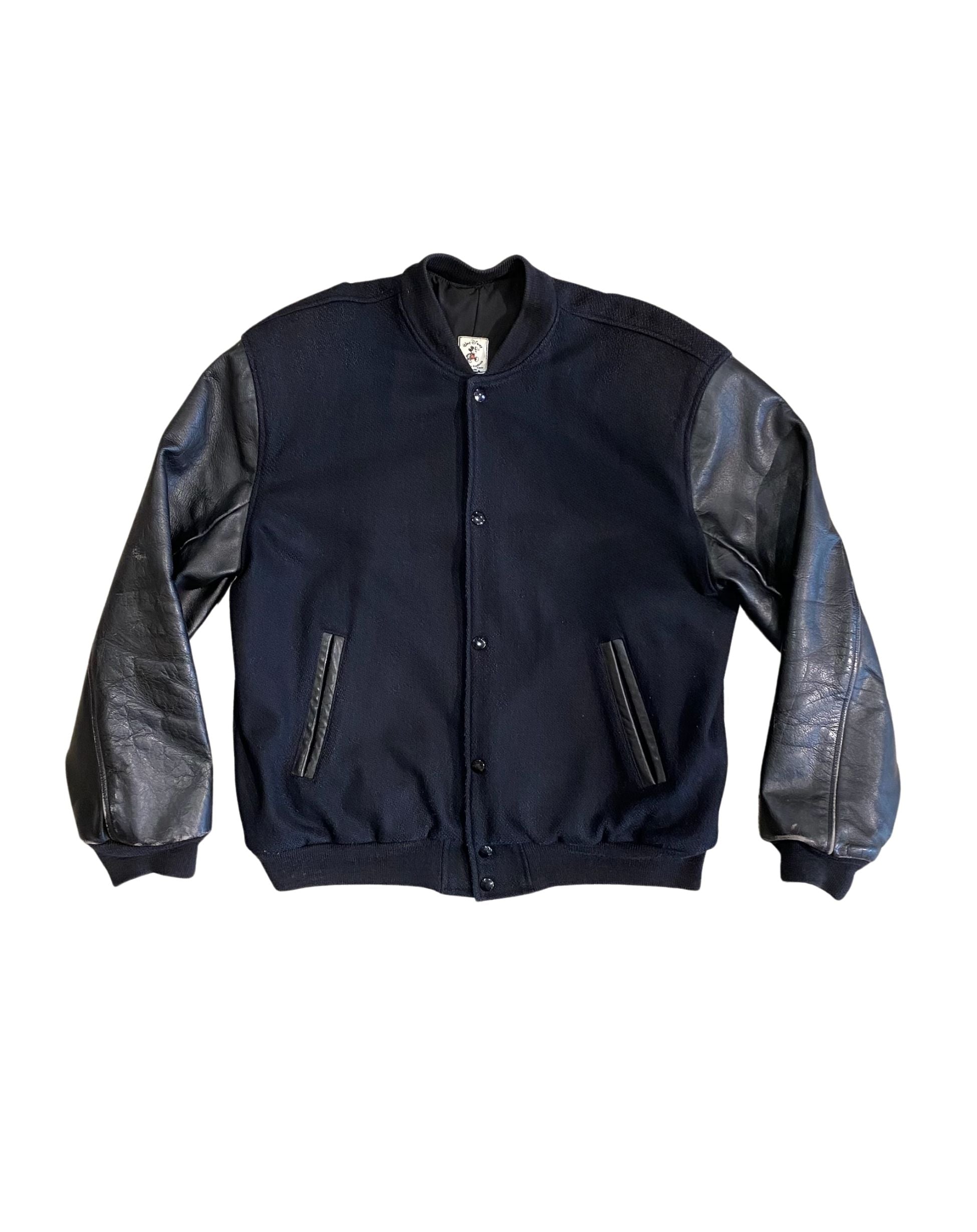 Front view of Disney wool varsity jacket with leather sleeves.