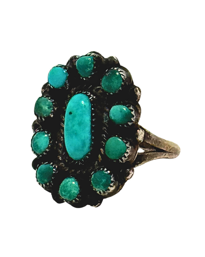 Turquoise and Sterling Silver Flower Ring 1970s on white background. 

