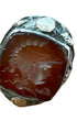 The front view of the Early 1800s Sterling 10K Gold Carnelian Conquistador Ring.