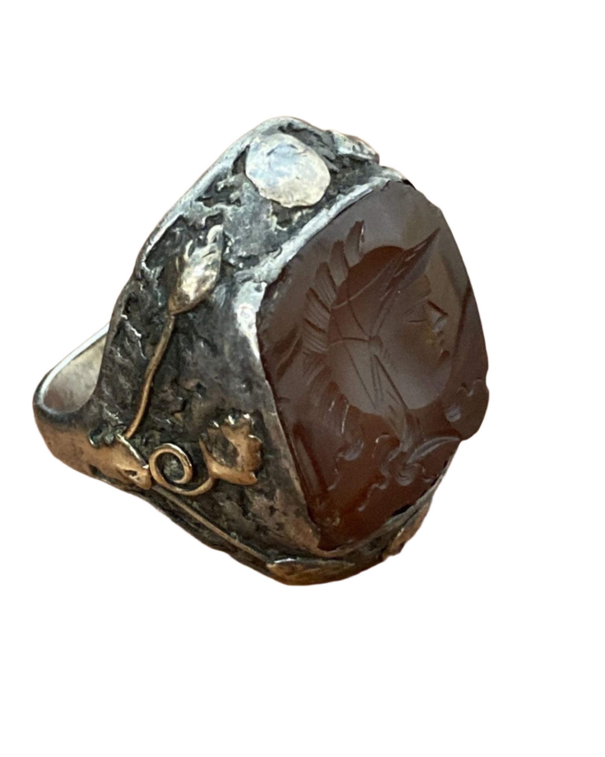 The left side view of the Early 1800s Sterling 10K Gold Carnelian Conquistador Ring.