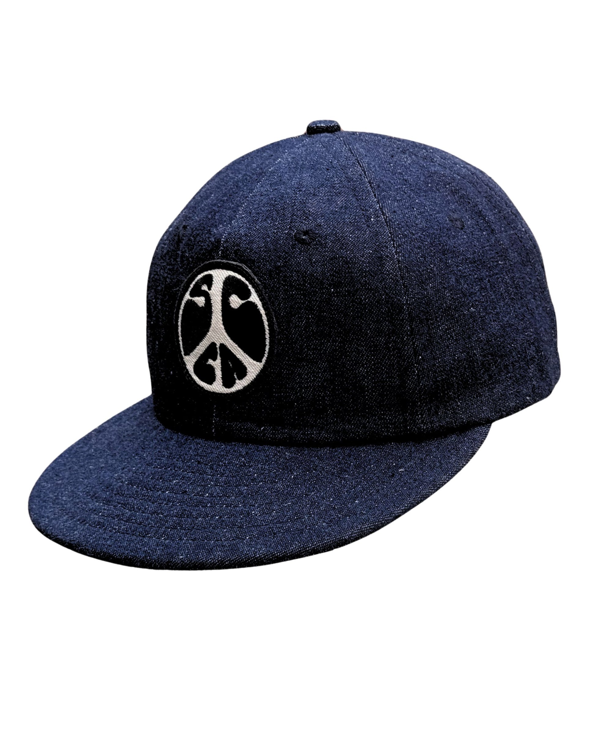 Upper angled view of Surfing Cowboys dark-denim Peace Patch Shop Cap with eight-row stitched bill.