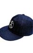 Upper view of Surfing Cowboys dark-denim Peace Patch Shop Cap with eight-row stitched bill.