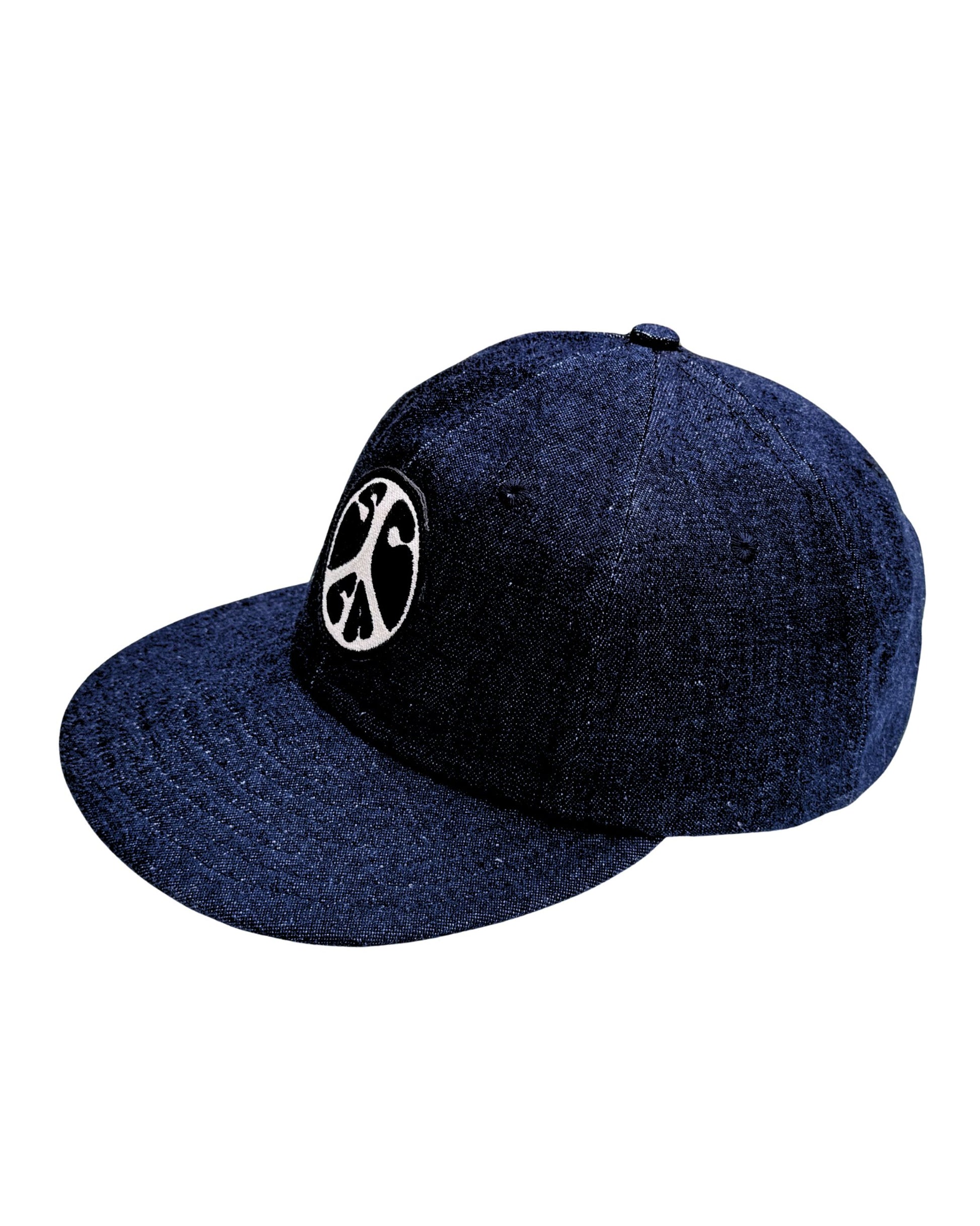 Upper view of Surfing Cowboys dark-denim Peace Patch Shop Cap with eight-row stitched bill.