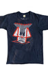 Front of black 1982 Foreigner concert T-shirt with red and white “4” locomotive graphic.